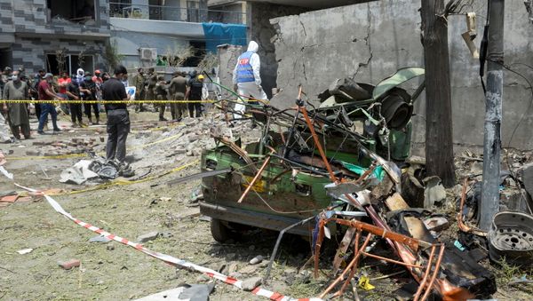 A member of the Counter Terrorism Department (CTD) surveys the site after a deadly blast in residential area in Lahore, Pakistan June 23, 2021 - Sputnik International