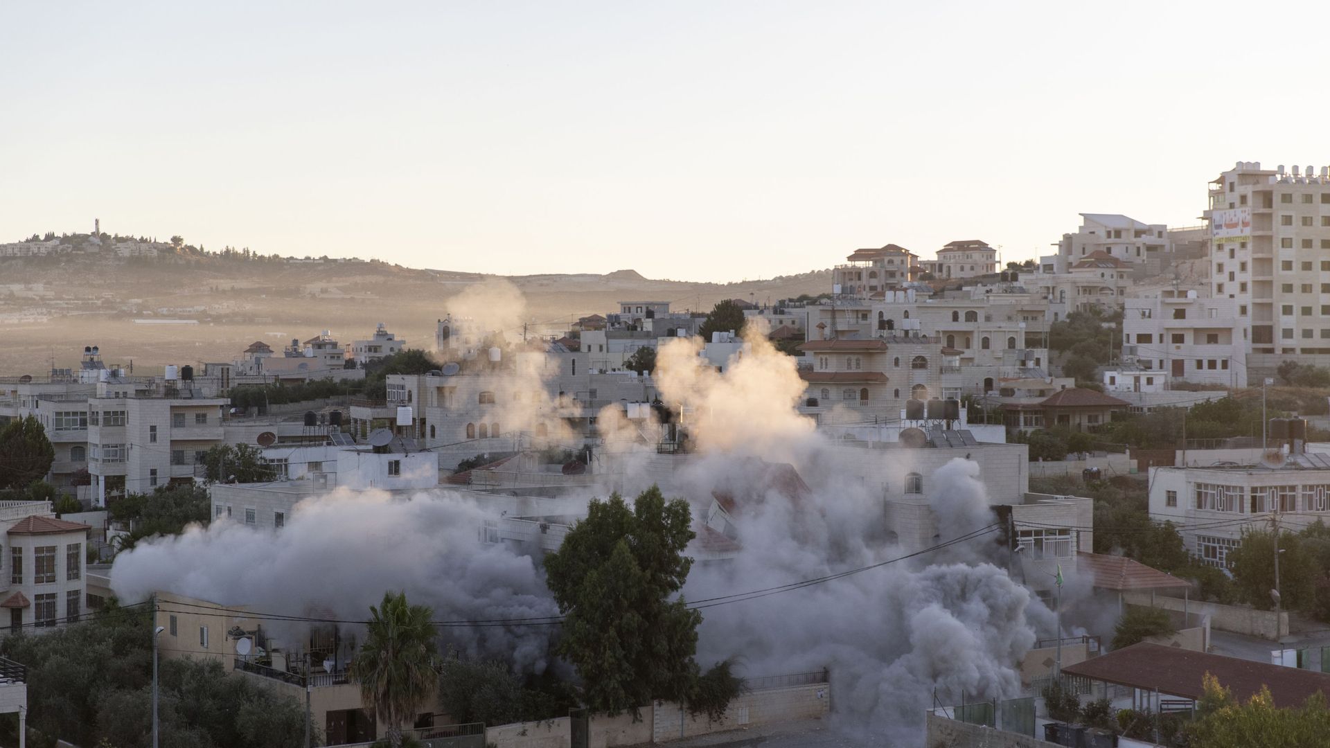 An Israeli army unit demolishes the house of Palestinian American Muntasser Shalaby using controlled explosions, in the West Bank village of Turmus Ayya, north of Ramallah, Thursday, July. 8, 2021. An Israeli army unit demolishes the house of Palestinian American Muntasser Shalaby using controlled explosions, in the West Bank village of Turmus Ayya, north of Ramallah, Thursday, July. 8, 2021. - Sputnik International, 1920, 08.07.2021