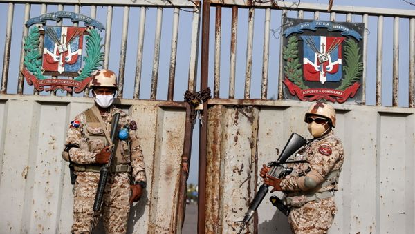 Members of the National Army guard the bridge between the Dominican Republic and Haiti, after the shared border was closed when Haiti's President Jovenel Moise was shot dead by gunmen at his private home in Port-au-Prince, in Dajabon, Dominican Republic July 8, 2021. - Sputnik International