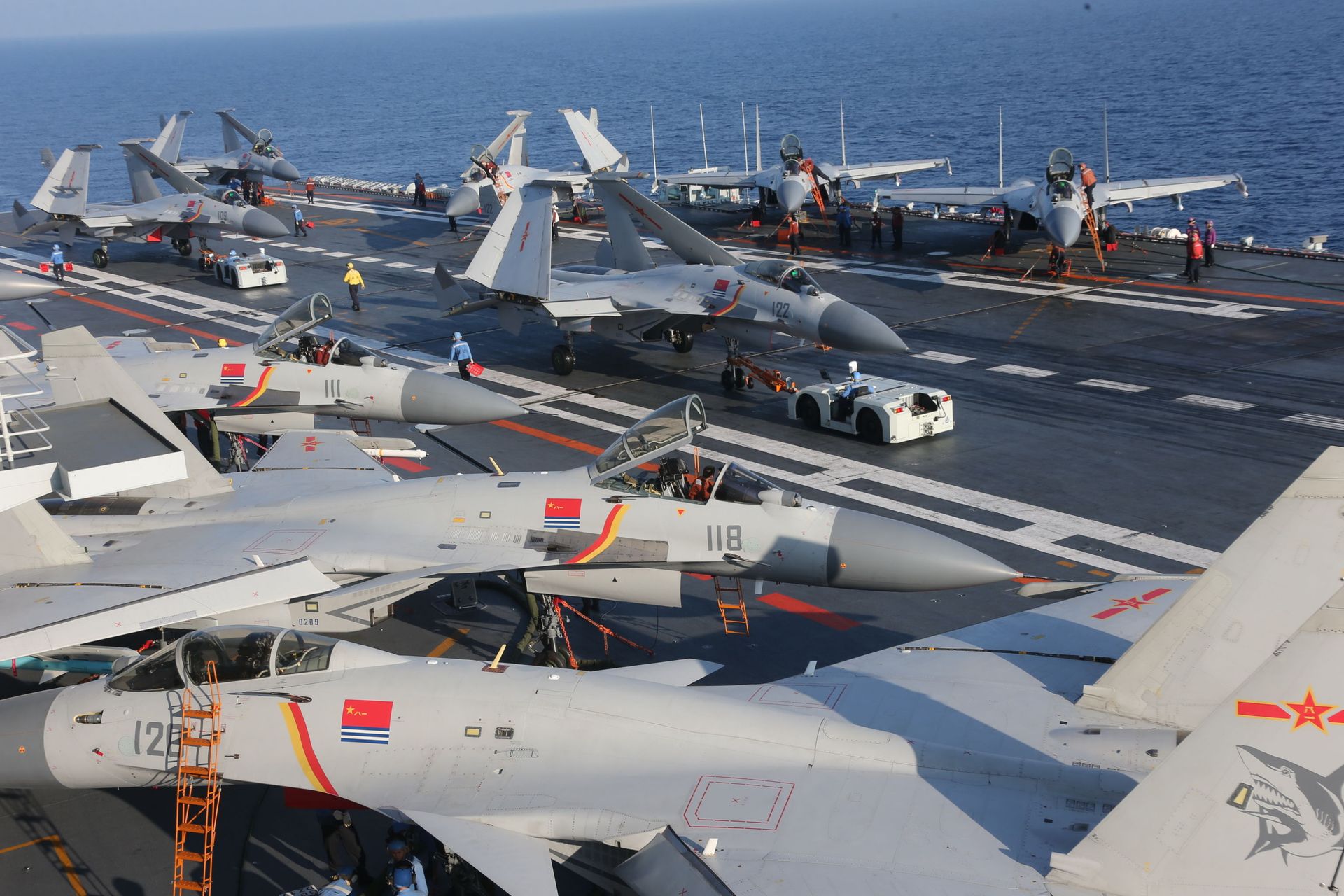 People's Liberation Army Navy J-15 Flying Shark fighters parked about the Chinese aircraft carrier Liaoning People's Liberation Army Navy J-15 Flying Shark fighters parked about the Chinese aircraft carrier Liaoning - Sputnik International, 1920, 07.09.2021