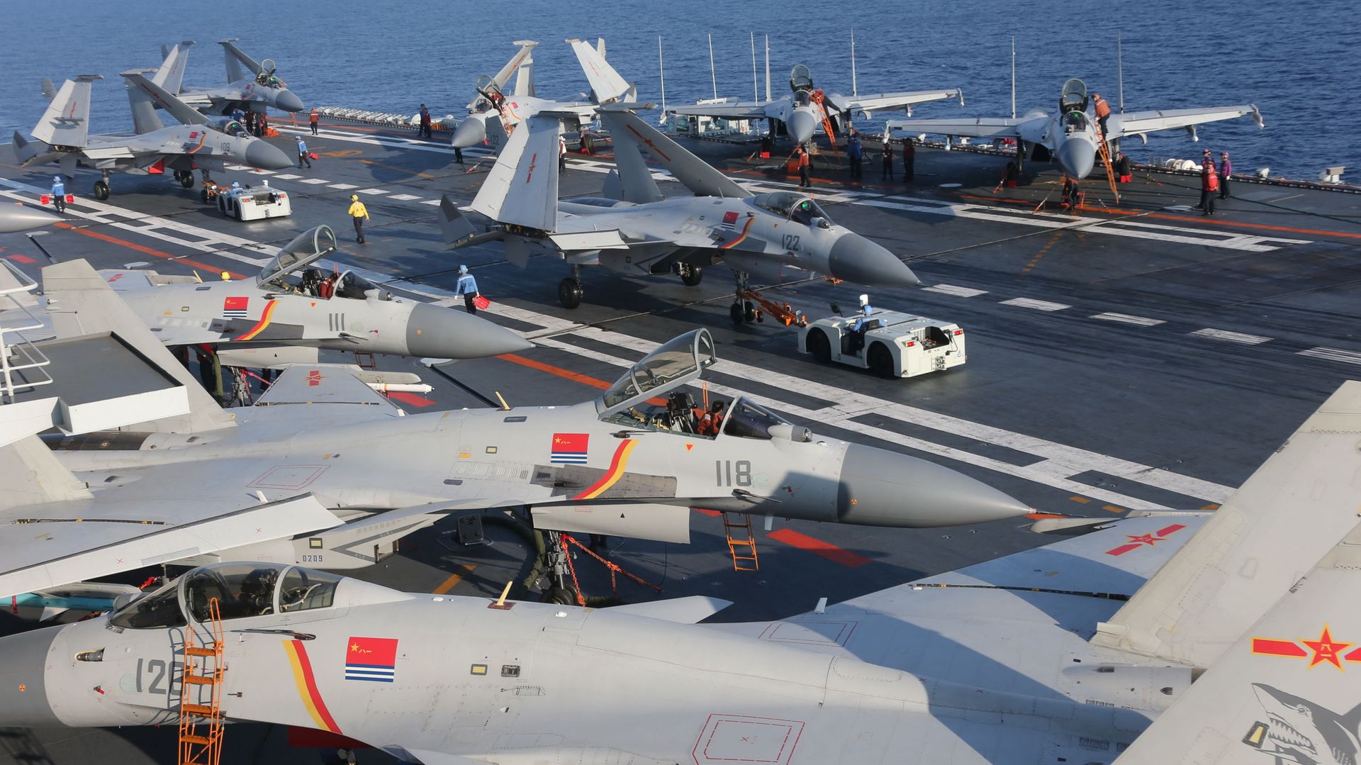 People's Liberation Army Navy J-15 Flying Shark fighters parked about the Chinese aircraft carrier Liaoning People's Liberation Army Navy J-15 Flying Shark fighters parked about the Chinese aircraft carrier Liaoning - Sputnik International, 1920, 08.07.2021