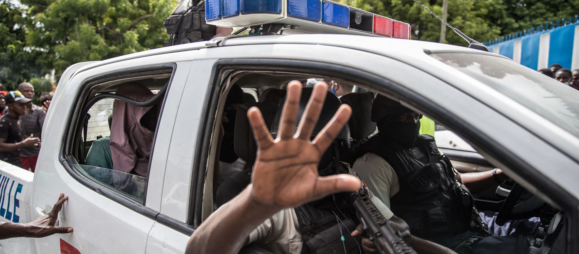 Two men, accused of being involved in the assassination of President Jovenel Moise, are being transported to the Petionville station in a police car in Port au Prince on July 8, 2021 - Sputnik International, 1920, 10.07.2021