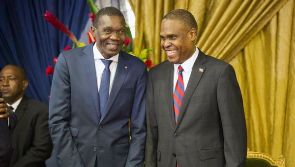 Haiti's new prime minister Jean-Henry Ceant, right, talks to Senate President Joseph Lambert during the nomination ceremony at the national Palace in Port-au-Prince, Haiti, Tuesday, Aug. 7, 2018.  - Sputnik International