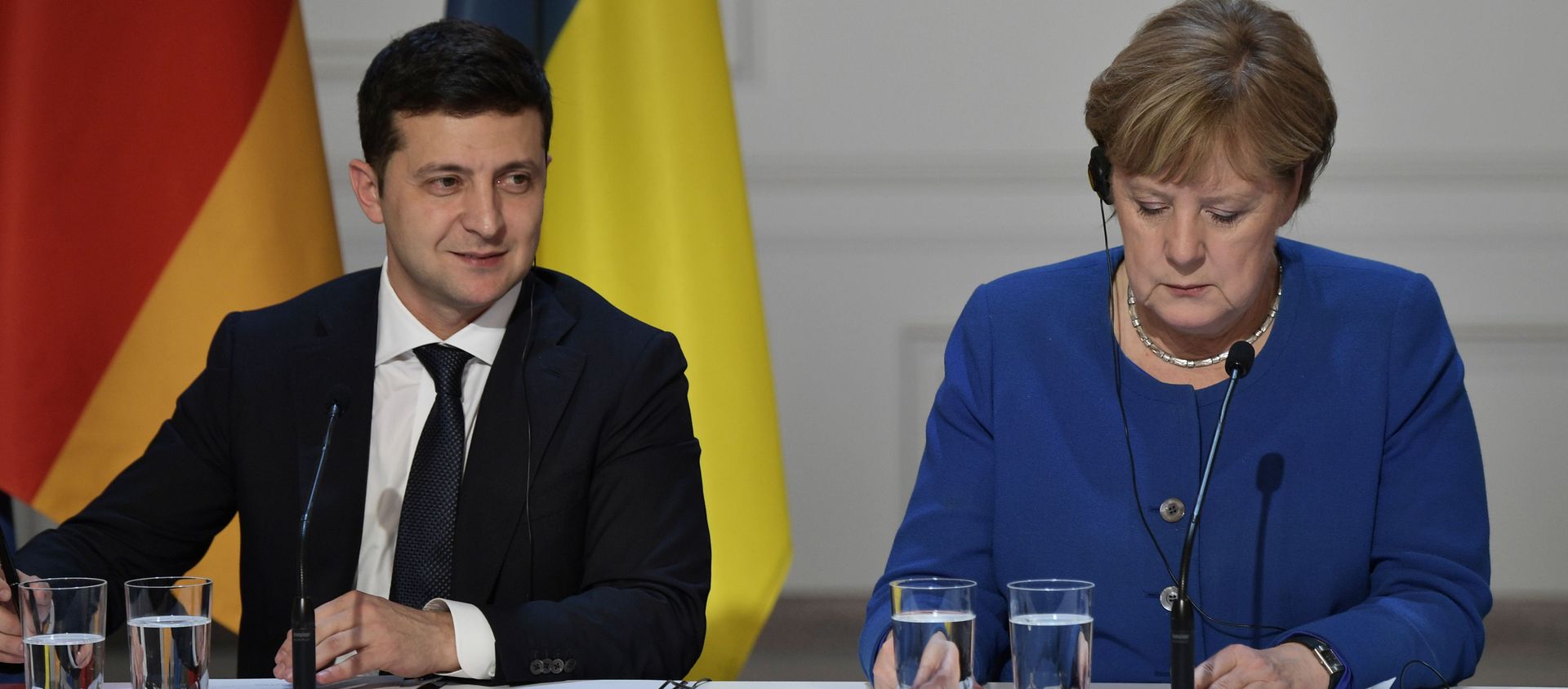 Ukrainian President Volodymyr Zelensky and German Chancellor Angela Merkel attend a joint news conference following a meeting of the Normandy Four leaders at the Elysee Palace in Paris, France. 2019. - Sputnik International, 1920, 10.07.2021