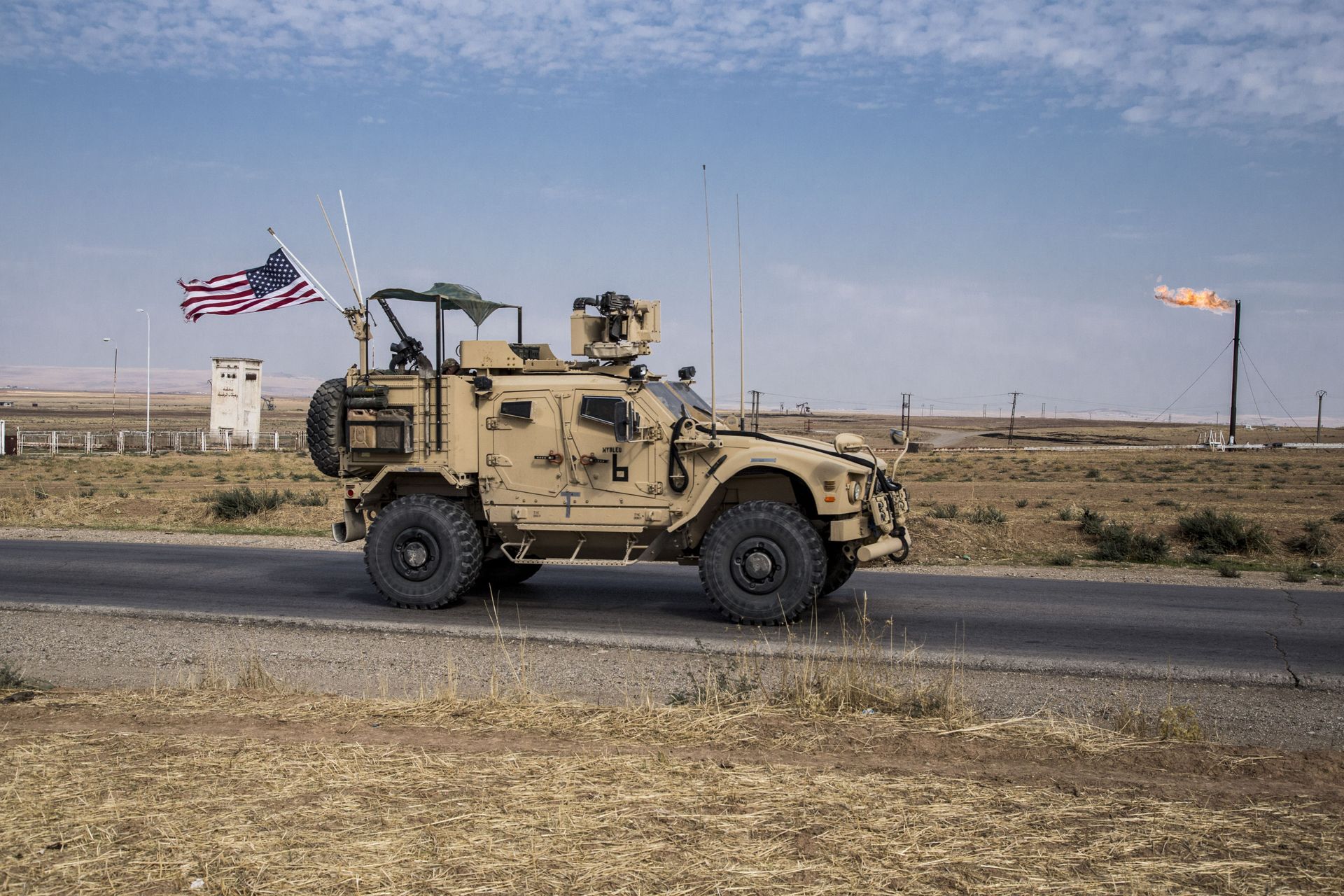 In this Monday, Oct. 28, 2019 file photo, U.S. forces patrol Syrian oil fields, in eastern Syria.President Donald Trump's decision to dispatch new U.S. forces to eastern Syria to secure oil fields is being criticized by some experts as ill-defined and ambiguous. In this Monday, Oct. 28, 2019 file photo, U.S. forces patrol Syrian oil fields, in eastern Syria.President Donald Trump's decision to dispatch new U.S. forces to eastern Syria to secure oil fields is being criticized by some experts as ill-defined and ambiguous. - Sputnik International, 1920, 14.05.2022