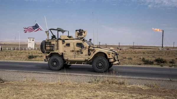 In this Monday, Oct. 28, 2019 file photo, U.S. forces patrol Syrian oil fields, in eastern Syria.President Donald Trump's decision to dispatch new U.S. forces to eastern Syria to secure oil fields is being criticized by some experts as ill-defined and ambiguous. - Sputnik International