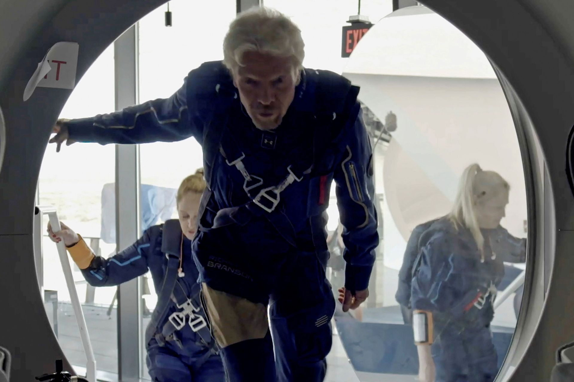 Richard Branson and Virgin Galactic crew members enter the company's passenger rocket plane, the VSS Unity, in a still image from undated handout video taken at Spaceport America near Truth or Consequences, New Mexico, US - Sputnik International, 1920, 07.09.2021