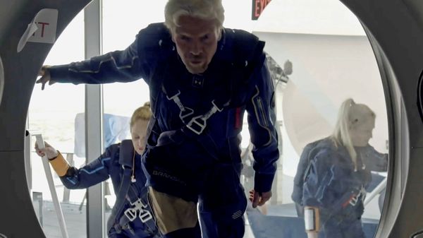 Richard Branson and Virgin Galactic crew members enter the company's passenger rocket plane, the VSS Unity, in a still image from undated handout video taken at Spaceport America near Truth or Consequences, New Mexico, US - Sputnik International
