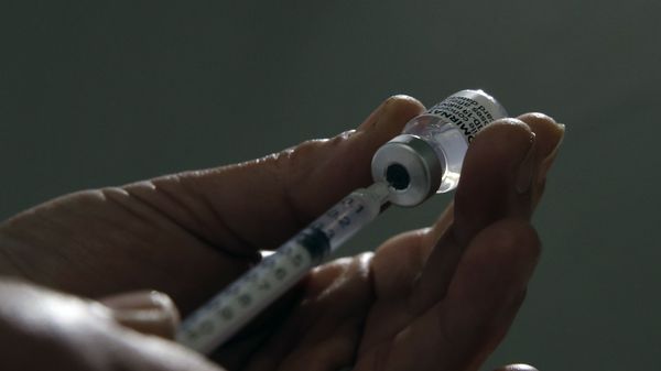In this file photo dated Sunday, April 4, 2021, a  member of the medical staff prepares a dose of the  Pfizer COVID-19 vaccine, at a vaccination site in Sarcelles, outside Paris - Sputnik International