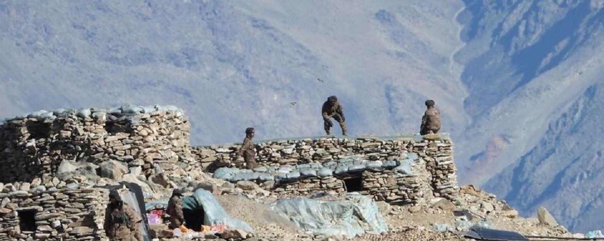 This photograph provided by the Indian Army, according to them shows Chinese troops dismantling their bunkers at Pangong Tso region, in Ladakh along the India-China border on Monday, Feb.15, 2021 This photograph provided by the Indian Army, according to them shows Chinese troops dismantling their bunkers at Pangong Tso region, in Ladakh along the India-China border on Monday, Feb.15, 2021 - Sputnik International, 1920, 27.10.2021