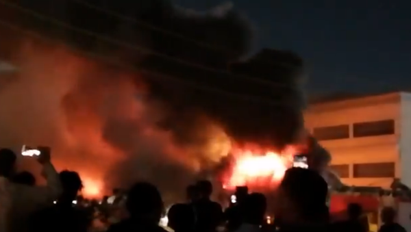 Screenshot from a video allegedly showing the Al-Hussein coronavirus hospital in Iraq engulfed in flames - Sputnik International