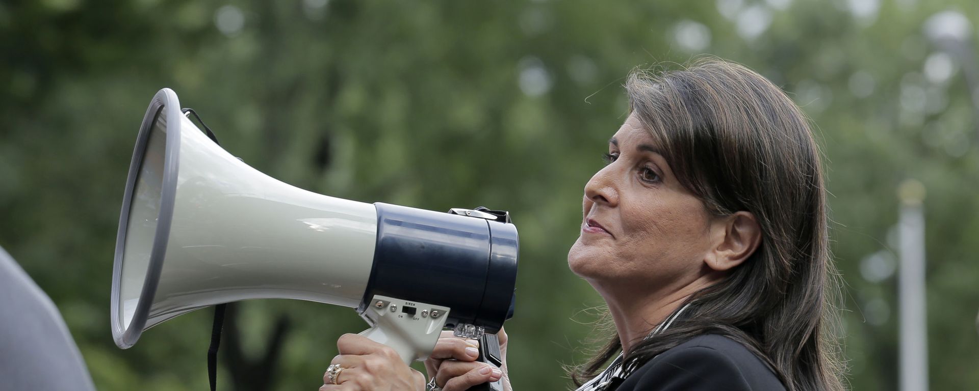 Surrounded by security, United States Ambassador to the United Nations Nikki Haley speaks briefly to people at a protest against Venezuelan President Nicolas Maduro outside United Nations headquarters in New York, Thursday, Sept. 27, 2018 - Sputnik International, 1920, 23.06.2022