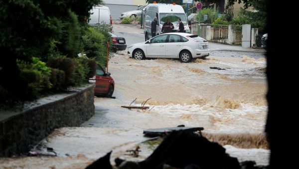 A flooded street is seen following heavy rainfalls in Hagen, Germany, July 14, 2021.   REUTERS/Leon Kuegeler - Sputnik International