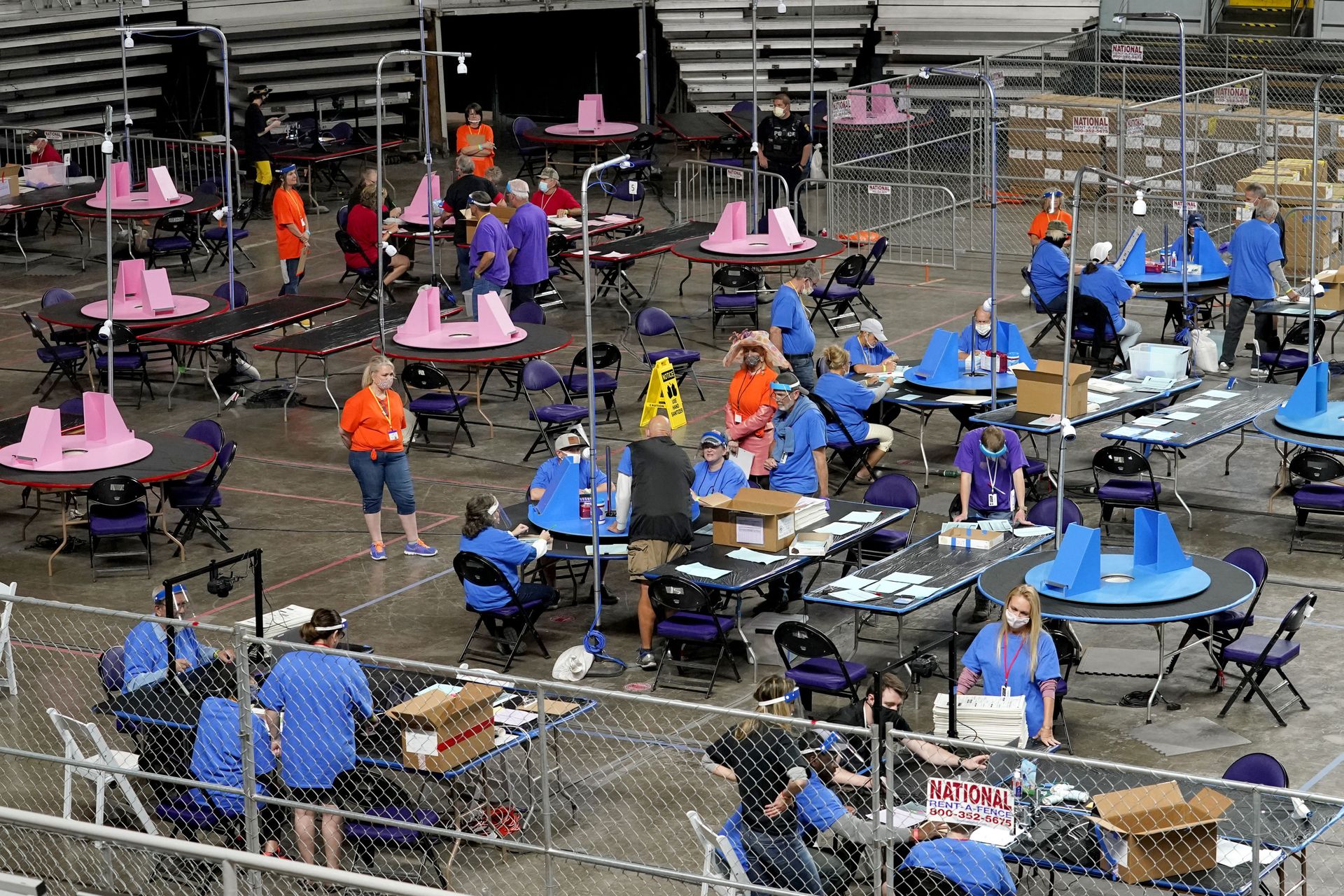 In this May 6, 2021, file photo, Maricopa County ballots cast in the 2020 general election are examined and recounted by contractors working for Florida-based company, Cyber Ninjas at Veterans Memorial Coliseum in Phoenix. Arizona’s largest county has approved nearly $3 million for new vote-counting machines to replace those given to legislative Republicans for a partisan review of the 2020 election. The GOP-controlled Maricopa County Board of Supervisors said Wednesday, July 14, 2021 that the machines were compromised because they were in the control of firms not accredited to handle election equipment. (AP Photo/Matt York, Pool, File) - Sputnik International, 1920, 07.09.2021