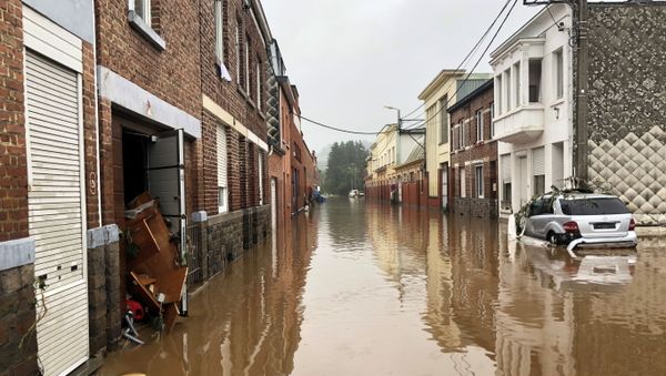 A partially-submerged car is seen on a flooded street in Pepinster, Belgium July 15, 2021 - Sputnik International