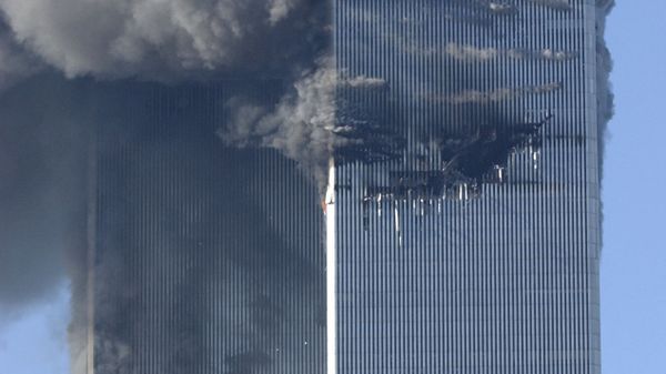 Smoke billows from the North and South Towers of the World Trade Center before they collapsed on September 11, 2001 in New York, NY - Sputnik International