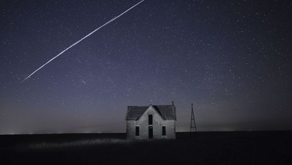 File-In this photo taken 6 May 2021, with a long exposure, a string of SpaceX StarLink satellites passes over an old stone house. File-In this photo taken 6 May 2021, with a long exposure, a string of SpaceX StarLink satellites passes over an old stone house. - Sputnik International