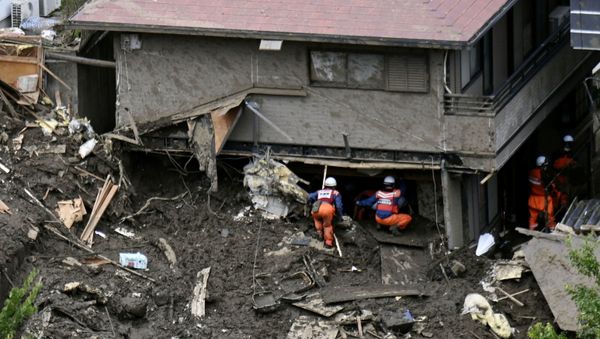 Rescue and search operation continues at the site of a mudslide which was caused by heavy rain at Izusan district in Atami, Japan - Sputnik International