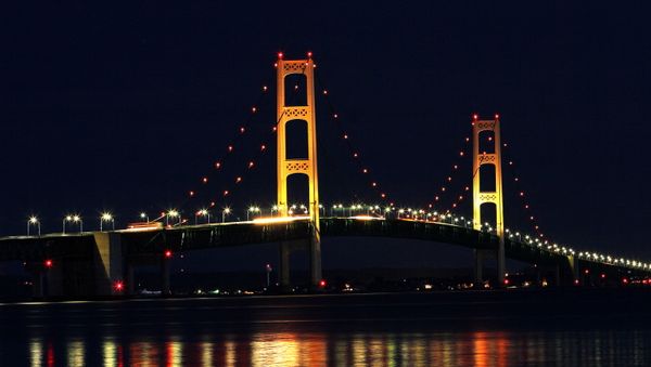 The Mackinaw Bridge July 27, 2008 as seen from St. Ignace, MI.The Mackinac Bridge straddles the Straits of Mackinac connecting Michigan's upper and lower peninsulas. Building it took three years, 2,500 men, 85,000 blueprints, 71,300 tons of structural steel, 466,3000 cubic yards of concrete, 41,000 miles of cable wire and millions of steel rivets and bolts. - Sputnik International