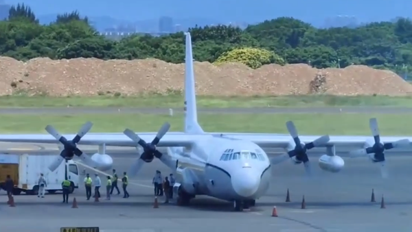 Lockheed L100-30 (C-130) tail number N3755P, owned by APA Leasing, on the tarmac at Taoyuan International Airport, Taiwan, on July 19, 2021. The aircraft is owned by a US charter company widely believed to be a CIA front. - Sputnik International