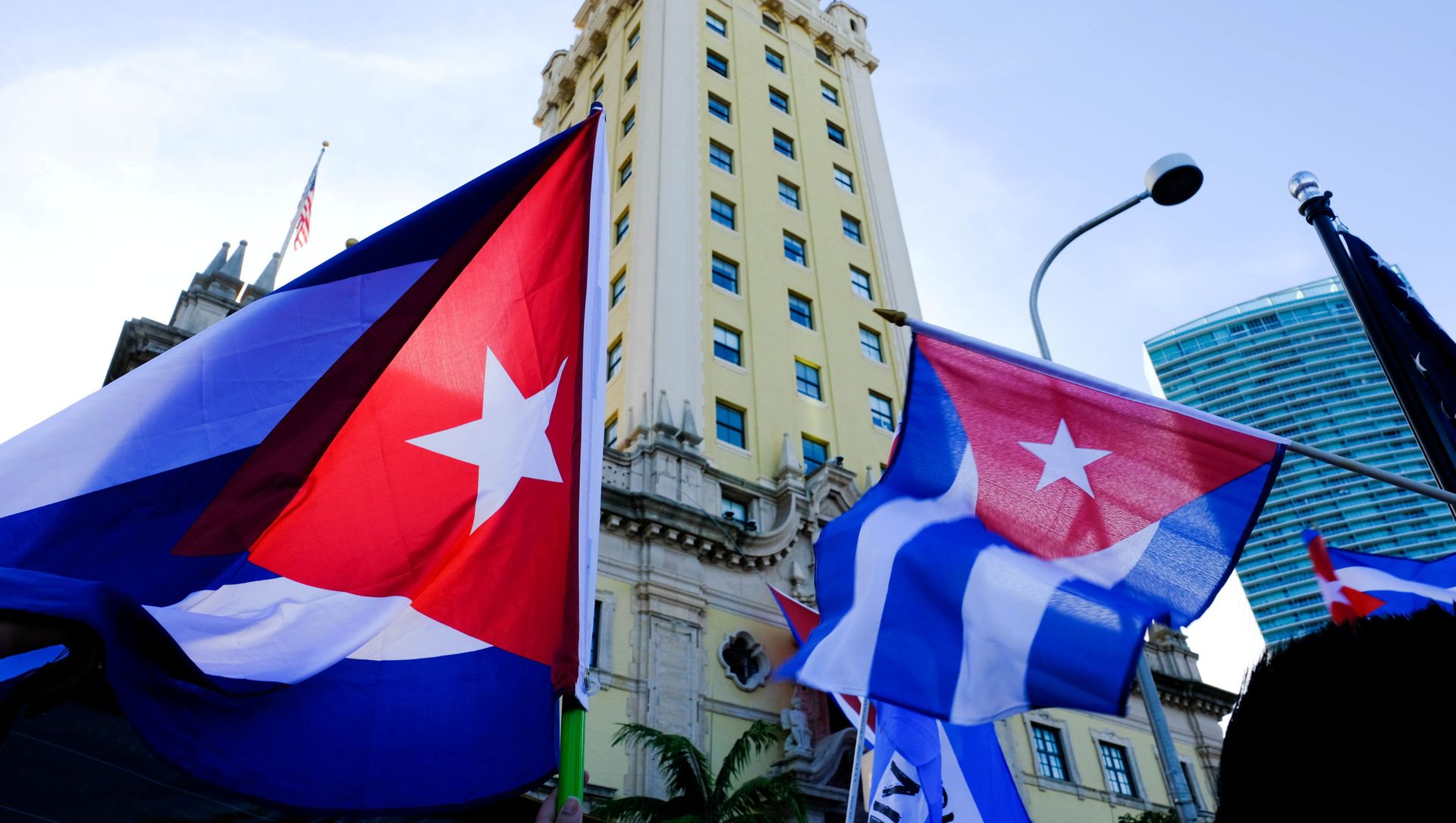Emigres wave Cuban flags at the Freedom Tower in reaction to reports of protests in Cuba against its deteriorating economy, in Miami, Florida, U.S. July 17, 2021 Emigres wave Cuban flags at the Freedom Tower in reaction to reports of protests in Cuba against its deteriorating economy, in Miami, Florida, U.S. July 17, 2021 - Sputnik International, 1920, 21.07.2021