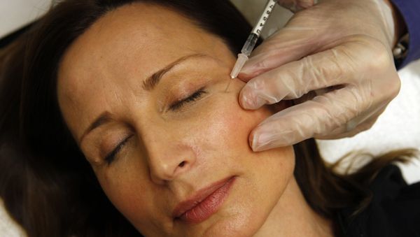 A woman receiving a Botox injection - Sputnik International