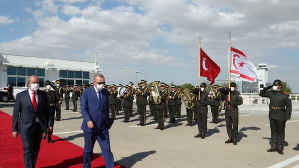 Turkish President Tayyip Erdogan reviews a guard of honour with Turkish Cypriot leader Ersin Tatar before he daparts from the Turkish Republic of Northern Cyprus, a breakway state recognized only by Turkey, in northern Nicosia, Cyprus July 20, 2021. Turkish President Tayyip Erdogan reviews a guard of honour with Turkish Cypriot leader Ersin Tatar before he daparts from the Turkish Republic of Northern Cyprus, a breakway state recognized only by Turkey, in northern Nicosia, Cyprus July 20, 2021. - Sputnik International