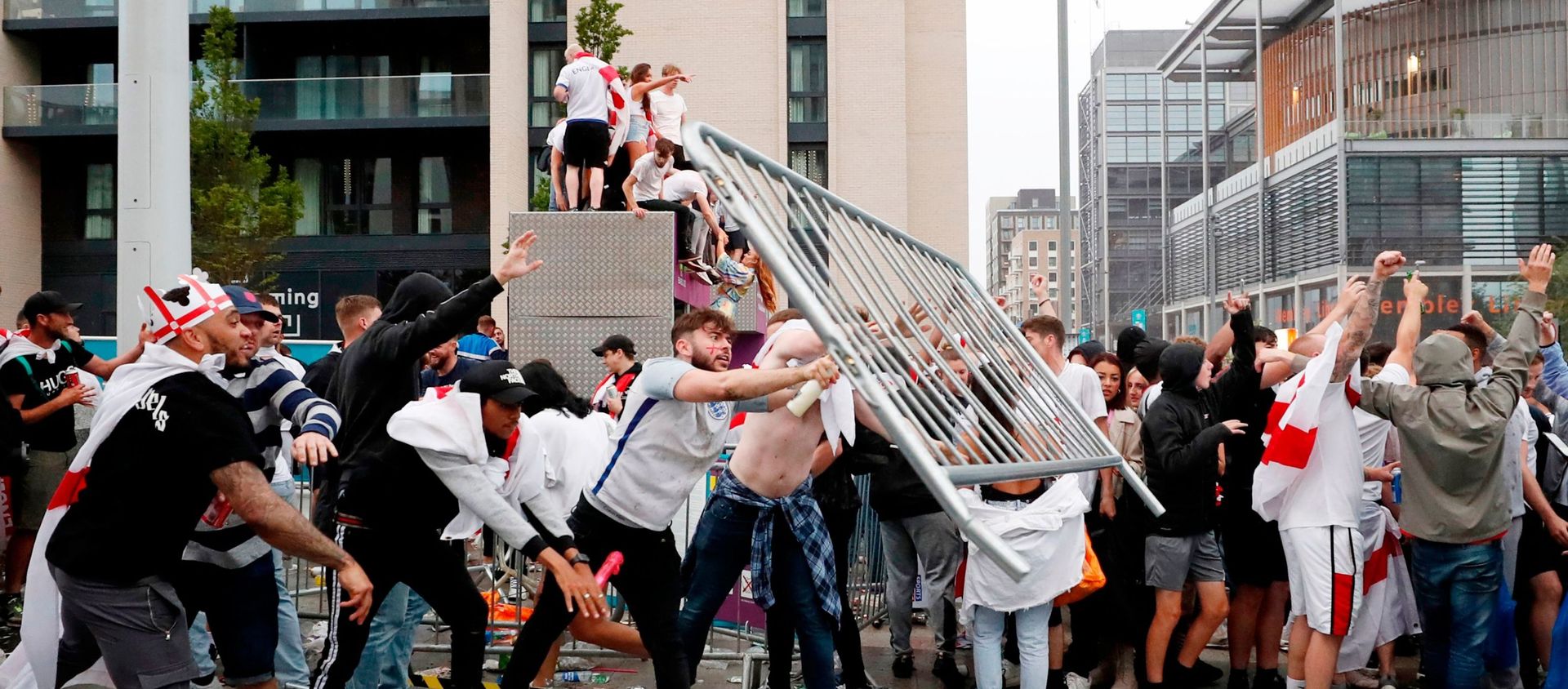 Soccer Football - Euro 2020 - Final - Fans gather for Italy v England - Wembley Stadium, London, Britain - July 11, 2021 Picture taken July 11, 2021 England fans throw barriers outside Wembley Stadium during the match Action Images via Reuters/Lee Smith - Sputnik International, 1920, 22.07.2021