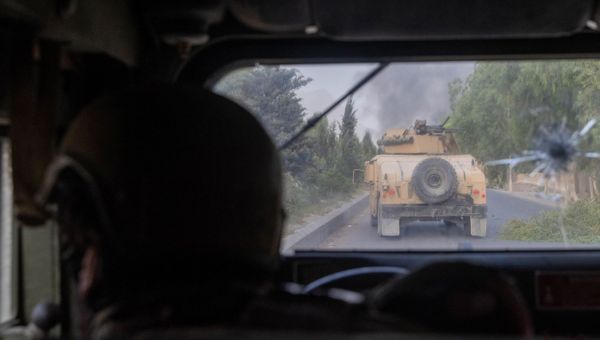 A member of Afghan Special Forces fires at Taliban after coming under heavy fire during the rescue mission of a police officer besieged at a check post, in Kandahar province, Afghanistan, July 13, 2021.  - Sputnik International