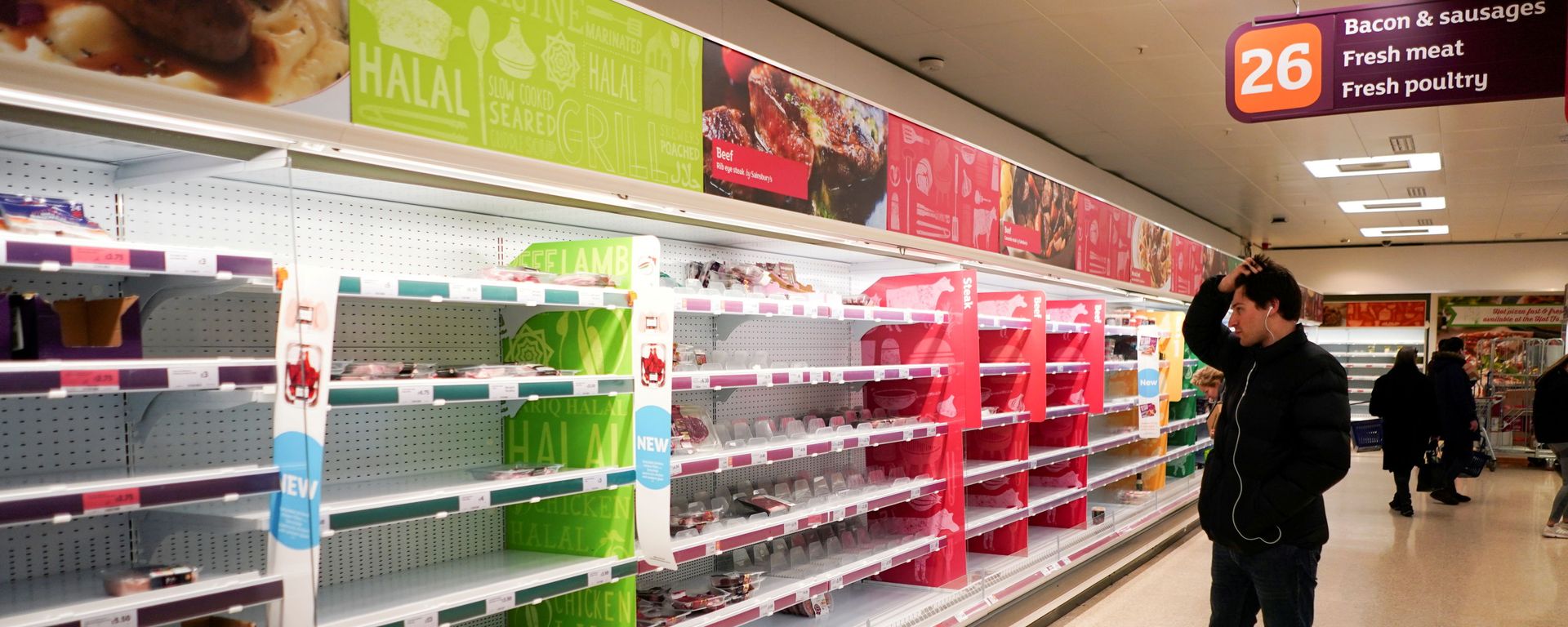 FILE PHOTO: A man stands next to shelves empty of fresh meat in a supermarket, as the number of worldwide coronavirus cases continues to grow,  in London, Britain, March 15, 2020 - Sputnik International, 1920, 24.07.2021