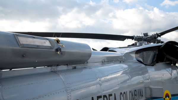 The mark of a projectile impact is seen on a helicopter that Colombian President Ivan Duque was traveling in, after it suffered an attack during an overflight, according to authorities, in Cucuta, Colombia June 25, 2021. - Sputnik International