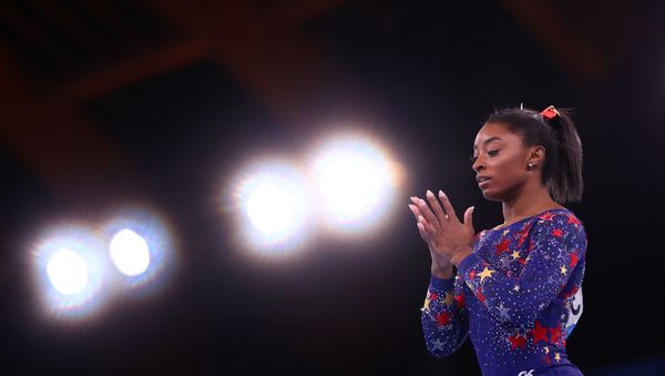 Tokyo 2020 Olympics - Gymnastics - Artistic - Women's Beam - Qualification - Ariake Gymnastics Centre, Tokyo, Japan - July 25, 2021. Simone Biles of the United States in action on the beam. - Sputnik International