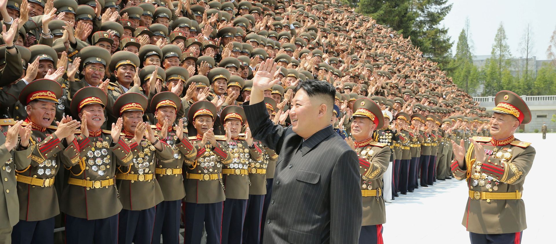 North Korea's leader Kim Jong Un greets participants of the first workshop of the commanders and political officers of the Korean People's Army (KPA) in Pyongyang, North Korea in this image supplied by North Korea's Korean Central News Agency on July 30, 2021. North Korea's leader Kim Jong Un greets participants of the first workshop of the commanders and political officers of the Korean People's Army (KPA) in Pyongyang, North Korea in this image supplied by North Korea's Korean Central News Agency on July 30, 2021. - Sputnik International, 1920, 08.08.2021
