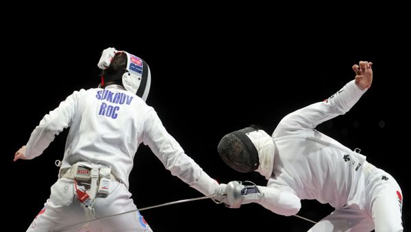 Tokyo 2020 Olympics - Fencing - Men's Team Epee - Gold medal match - Makuhari Messe Hall B - Chiba, Japan - July 30, 2021. Pavel Sukhov of the Russian Olympic Committee in action against Koki Kano of Japan REUTERS/Maxim Shemetov - Sputnik International