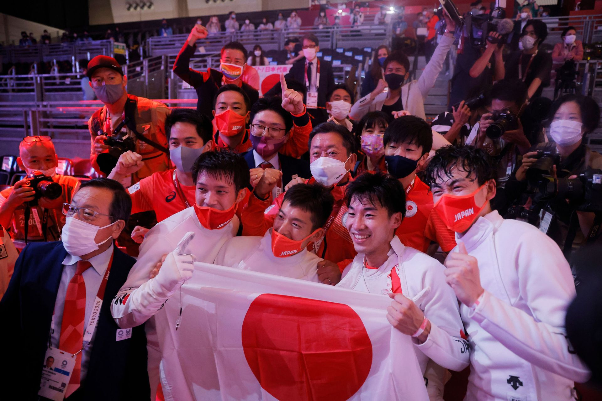 Tokyo 2020 Olympics - Fencing - Men's Team Epee - Gold medal match - Makuhari Messe Hall B - Chiba, Japan - July 30, 2021. Koki Kano of Japan, Kazuyasu Minobe of Japan, Masaru Yamada of Japan and Satoru Uyama of Japan celebrate with team members after winning gold REUTERS/Maxim Shemetov - Sputnik International, 1920, 07.09.2021