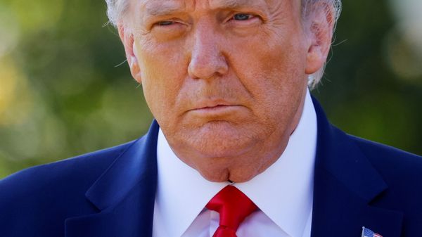 Then-U.S. President Donald Trump approaches reporters as he departs on campaign travel to Minnesota from the South Lawn at the White House in Washington, U.S., September 30, 2020. - Sputnik International