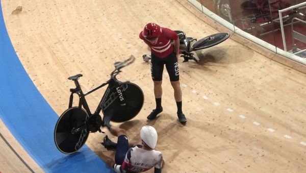 Frederik Madsen of Team Denmark and Charlie Tanfield of Team Britain (133) get up after crashing during the track cycling men's team pursuit at the 2020 Summer Olympics, Tuesday, Aug. 3, 2021, in Izu, Japan. - Sputnik International