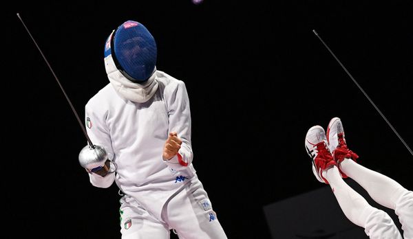 Italy's Enrico Garozzo (L) reacts as Japan's Koki Kano falls down during a men's epee individual qualifying bout.  - Sputnik International