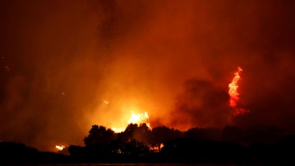 Night sky turns orange as Turkey's wildfires rage on at the shores of Cokertme village near Bodrum, Turkey, August 2, 2021. - Sputnik International