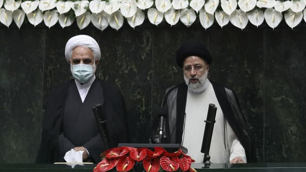 President Ebrahim Raisi, right, takes his oath as president, as Judiciary Chief Gholamhossein Mohseni Ejehi listens in a ceremony at the parliament in Tehran, Iran, Thursday, Aug. 5, 2021.  - Sputnik International