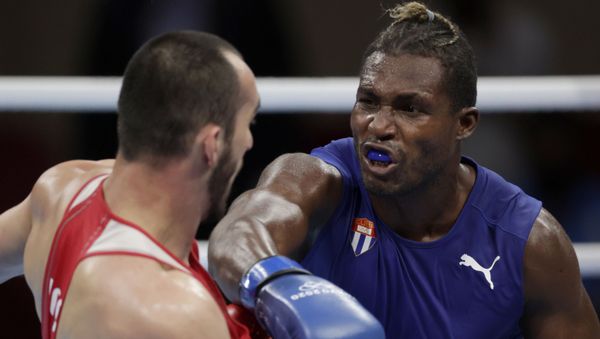 Tokyo 2020 Olympics - Boxing - Men's Heavyweight - Final - Kokugikan Arena - Tokyo, Japan - August 6, 2021. Julio Cesar La Cruz of Cuba in action against Muslim Gadzhimagomedov of the Russian Olympic Committee Tokyo 2020 Olympics - Boxing - Men's Heavyweight - Final - Kokugikan Arena - Tokyo, Japan - August 6, 2021. Julio Cesar La Cruz of Cuba in action against Muslim Gadzhimagomedov of the Russian Olympic Committee - Sputnik International