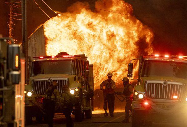 Firefighters work at the scene of a home engulfed in flames during the Dixie fire in Greenville, California on 4 August 2021. - Sputnik International