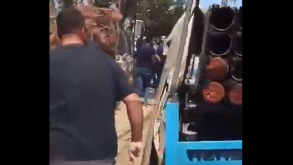 Villagers in the Lebanese town of Shouya stop a convoy of Hezbollah trucks after several rocket launches into northern Israel and the Golan Heights on August 6, 2021 - Sputnik International