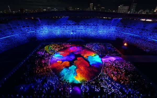 Olympic Stadium is lit up during the closing ceremony of the Tokyo 2020 Olympics. - Sputnik International