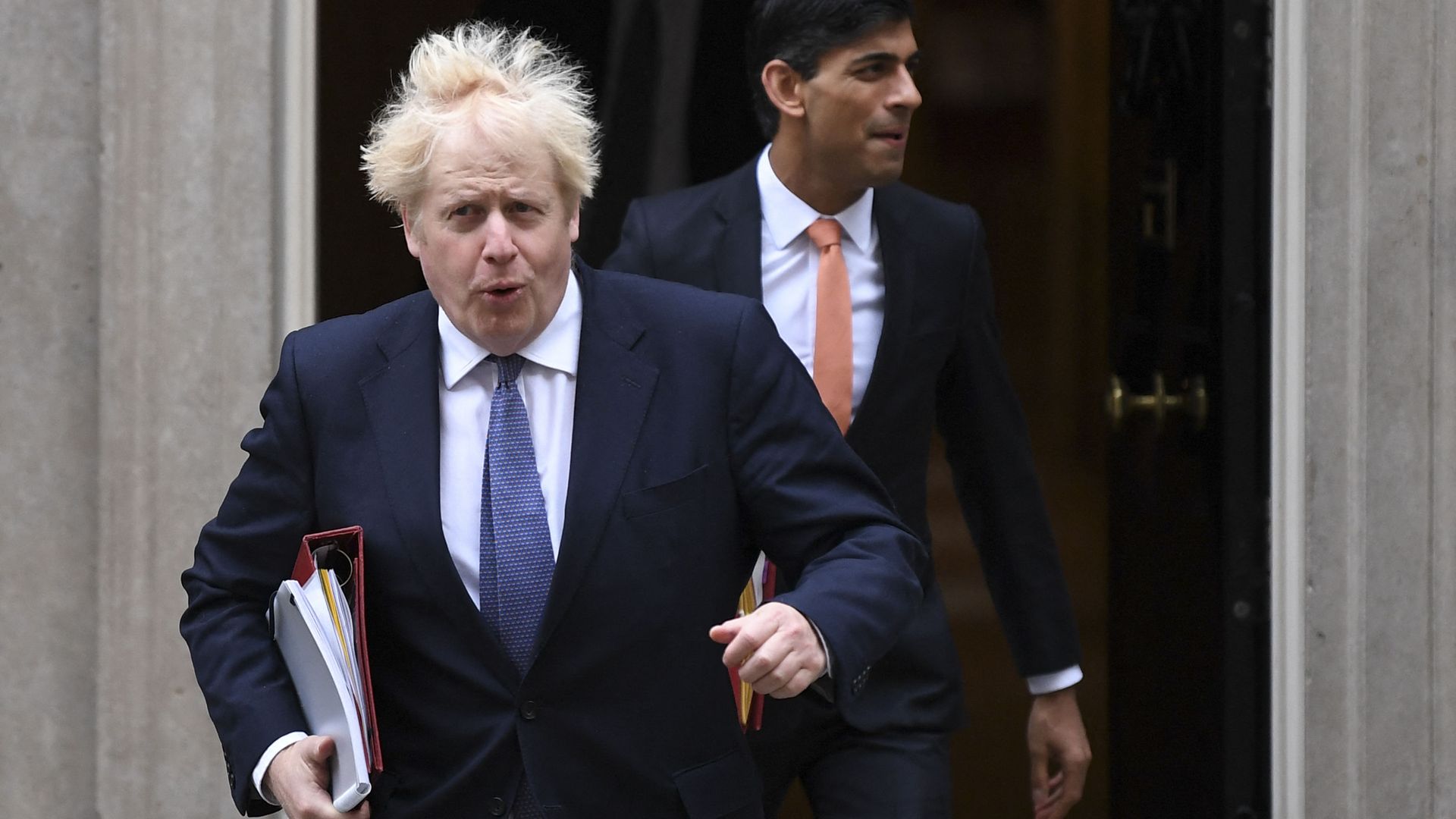 Britain's Prime Minister Boris Johnson (L) and Britain's Chancellor of the Exchequer Rishi Sunak (R) leave 10 Downing Street to attend the weekly cabinet meeting in London on October 13, 2020 held at the Foreign, Commonwealth and Development Office - Sputnik International, 1920, 12.06.2022