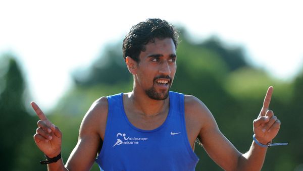 France's Morhad Amdouni celebrates after winning the 5000 meters final, during French Athletics Elite championships on June 24, 2016 at Lac de Maine stadium in Angers, western France. (Photo by JEAN-FRANCOIS MONIER / AFP) - Sputnik International