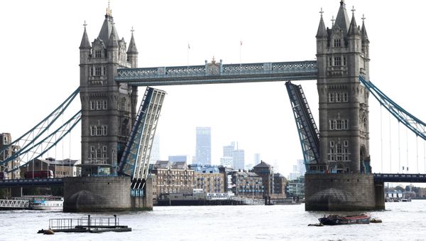 Tower Bridge is seen stuck in the open position, due to a technical fault, in London, Britain, August 9, 2021. REUTERS/Henry Nicholls Tower Bridge is seen stuck in the open position, due to a technical fault, in London, Britain, August 9, 2021. REUTERS/Henry Nicholls - Sputnik International