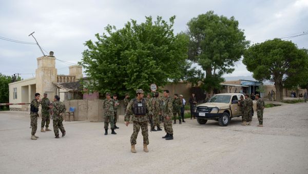 Afghan security personnel keep watch near the site of an ongoing attack on an army compound in Dihdadi District of Balkh province on April 21, 2017. -  - Sputnik International