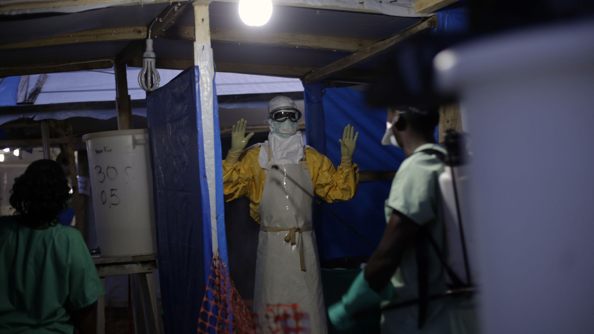 FILE- In this Nov. 20, 2014 file photo, an MSF Ebola heath worker is sprayed as he leaves the contaminated zone at the Ebola treatment centre in Gueckedou, Guinea FILE- In this Nov. 20, 2014 file photo, an MSF Ebola heath worker is sprayed as he leaves the contaminated zone at the Ebola treatment centre in Gueckedou, Guinea - Sputnik International, 1920, 10.08.2021