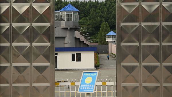A man walks inside the Dandong city detention center where Canadian businessman Michael Spavor is being held on spying charges in the border city of Dandong, in China's northeast Liaoning province on August 11, 2021 - Sputnik International